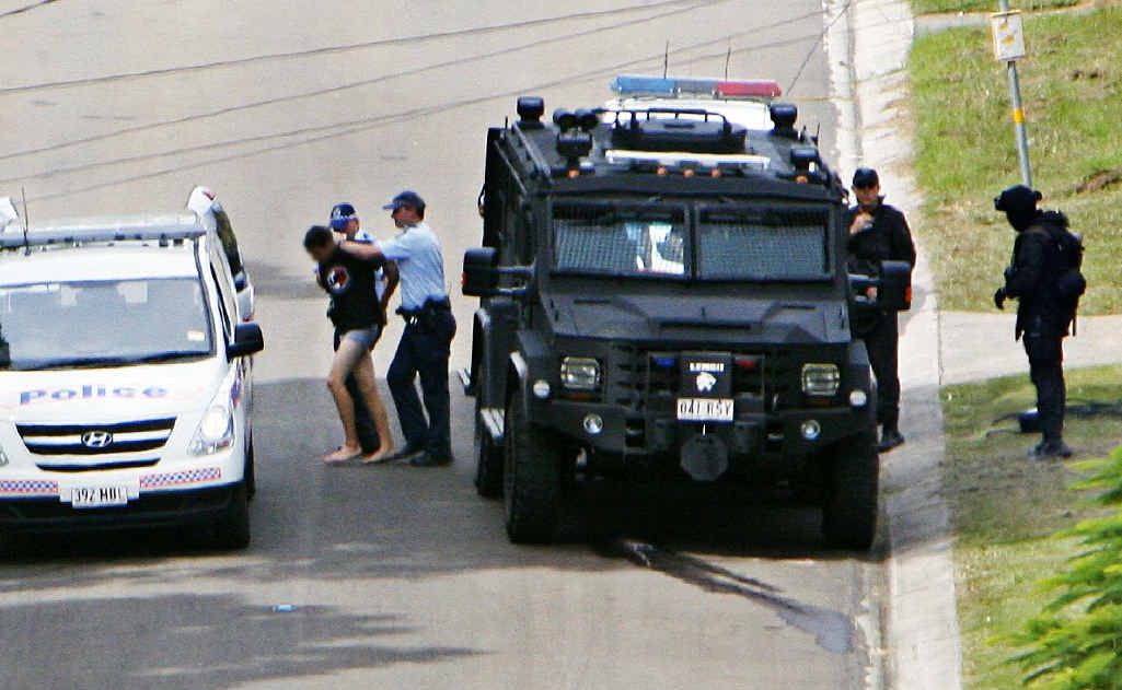 Police escort Nicholas Alexander Brown, 18, from Kanangra St, Redbank Plains, in April after he allegedly held his mother and sister hostage at knifepoint. Police escort Nicholas Alexander Brown, 18, from Kanangra St, Redbank Plains, in April after he allegedly held his mother and sister hostage at knifepoint.